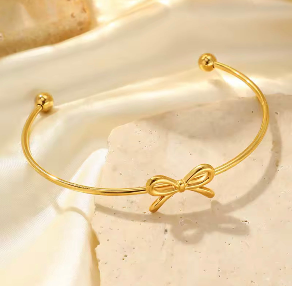 Gold bow cuff